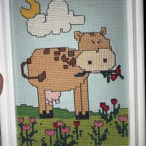 Vintage BUCILLA  cross stitch of cow eating tulips in white wood frame